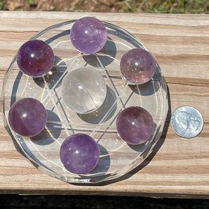 Glass crystal grid with six amethyst spheres and one clear quartz sphere